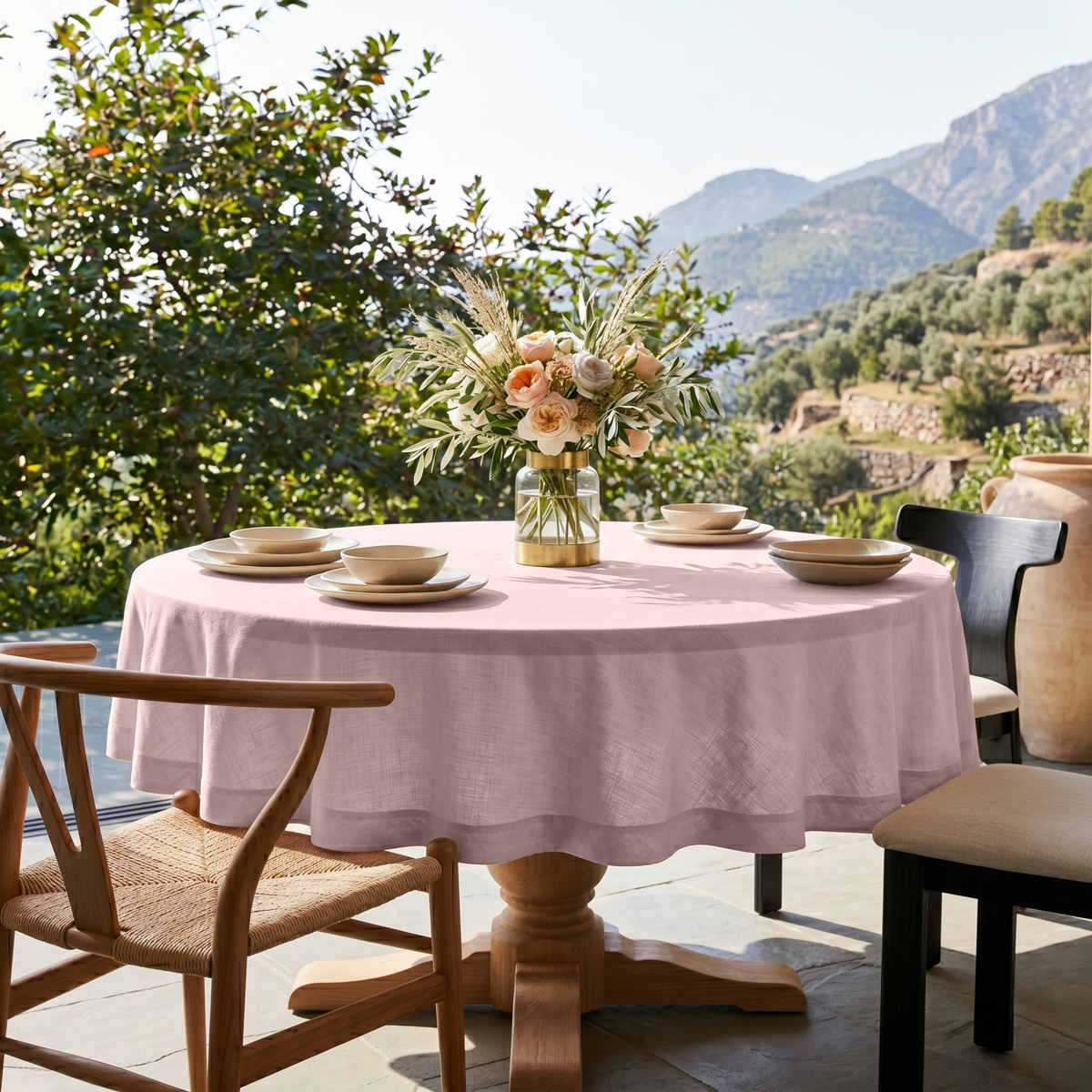 Dusty Pink Linen Round Tablecloth in a Sunlit Terrace Dining Space with Lush Greenery