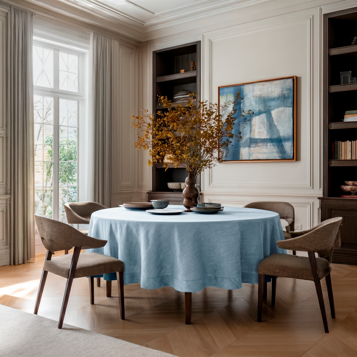 Sky Blue Linen Round Tablecloth in an Elegant Dining Room with Classic Cream Paneling and Dark Wood