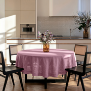 Dusty Rose Linen Round Tablecloth in a Modern Kitchen Dining Space with Cream Cabinetry and Black Wood Chairs