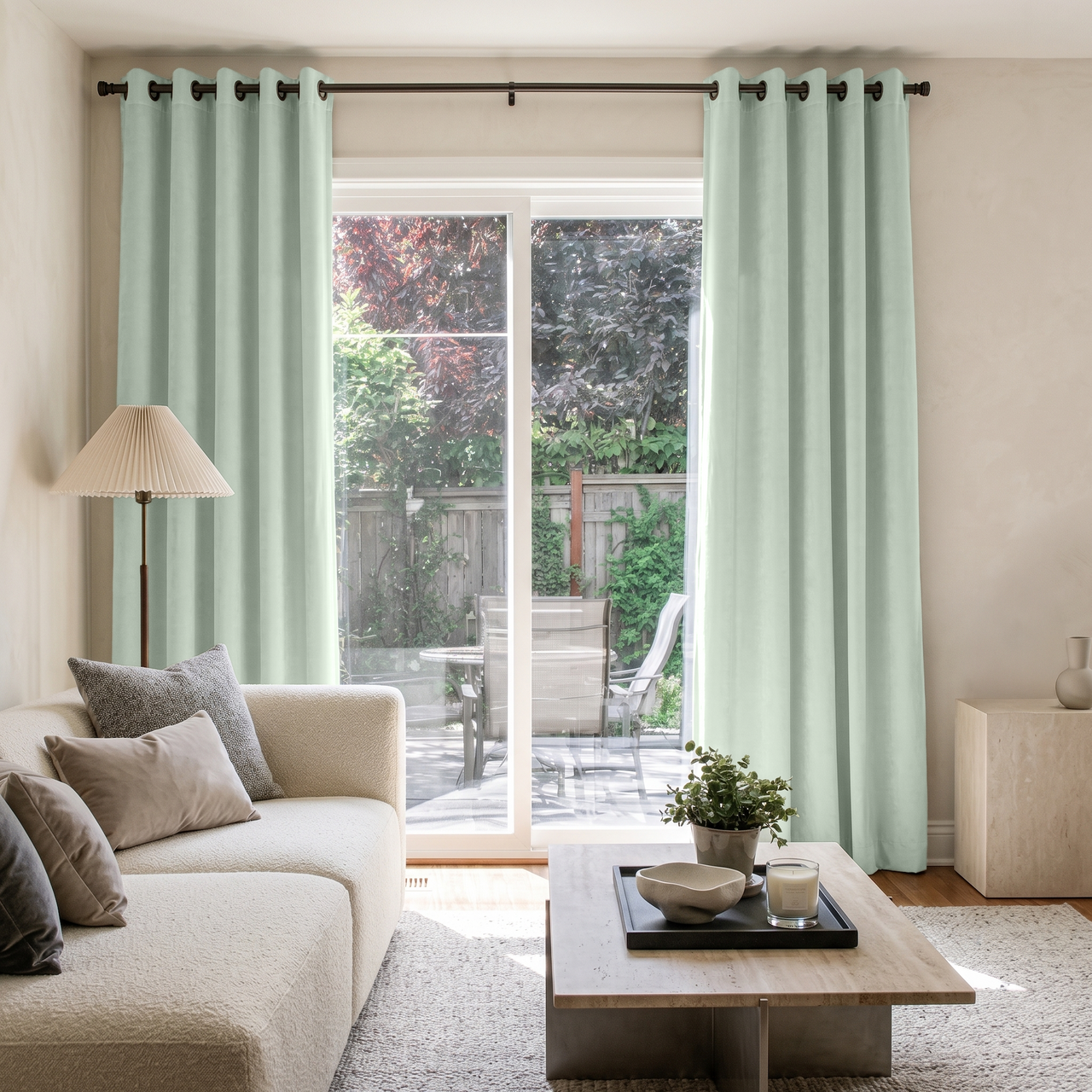Mint Green Velvet Eyelet Sliding Patio Door Curtains in a Minimal Living Room with a Cream Sofa and a Travertine Coffee Table
