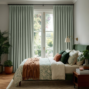Mint Green Velvet Pinch Pleat Blackout Curtains in a Bedroom with Light Grey Walls