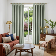 Mint Green Velvet Tab Top Blackout Curtains in a Living Room with Bright White Walls