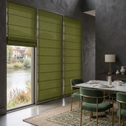 Moss Green Roman Blinds in a Contemporary Dining Room with Textured Grey Walls and Green Chairs