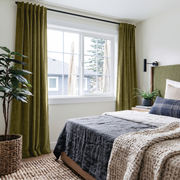 Moss Green Velvet Back Tab Curtains in a Modern Bedroom with Charcoal Bedding and a Green Upholstered Headboard