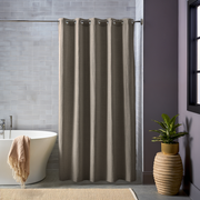 Natural Heavy Weight Linen Hookless Weighted Shower Curtain next to a Modern Bathtub