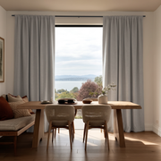 Natural Linen Rod Pocket Curtains in a Dining Room with Cream Walls, a Live-Edge Wooden Table and Woven Chairs - Blackout Lining