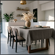 Natural Rectangular Heavy Weight Linen Tablecloth in a Modern Minimalist Kitchen with White Cabinetry and Bouclé Dining Chairs