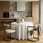 Off-White Linen Round Tablecloth in a Modern Kitchen Dining Area with Marble Backsplash and Fluted Oak Accents