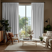 Off-White Velvet Pinch Pleat Blackout Curtains in a Living Room with Taupe Walls