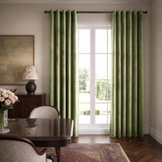 Classic dining room with olive green back-tab curtains, dark wooden furniture, and elegant décor.
