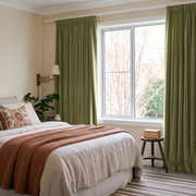 Olive Green Velvet Pencil Pleat Curtains in a Cozy Bedroom with Beige Walls and White Bedding