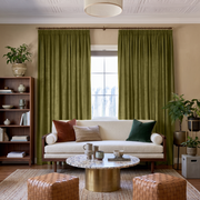 Moss Green Velvet Pencil Pleat Curtains in a Contemporary Living Room with Beige Walls and a Cream Sofa
