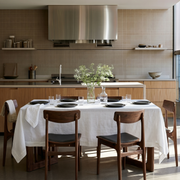 Off-White Rectangular Linen Tablecloth in a Modern Kitchen Dining Area with Walnut Cabinetry