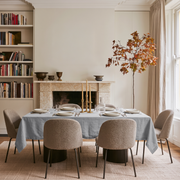 Stone Grey Rectangular Linen Tablecloth in a Contemporary Dining Room with Marble Fireplace and Built-In Bookshelves