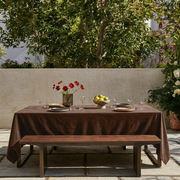 Chocolate Brown Rectangular Velvet Tablecloth in a Contemporary Patio Dining Area with Wooden Bench