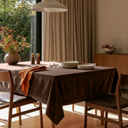 Chocolate Brown Rectangular Velvet Tablecloth in a Mid-Century Modern Dining Room with Walnut Sideboard and Beige Curtains