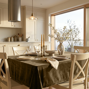 Olive Brown Rectangular Velvet Tablecloth in a Modern Farmhouse Kitchen with Cream Cabinetry and White Cross-Back Chairs