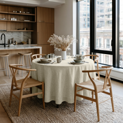 Ecru Heavy Weight Linen Round Tablecloth in a City Dining Room with Soft White Walls and Walnut Wood