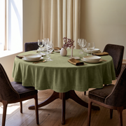Olive Green Round Velvet Tablecloth in an Elegant Dining Room with Beige Curtains and Dark Brown Chairs
