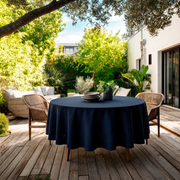Royal Blue Linen Round Tablecloth in a Sunny Patio Dining Space with Woven Wood