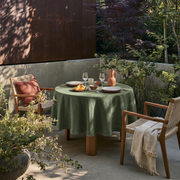 Sage Green Linen Round Tablecloth in a Garden Patio Dining Space