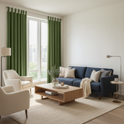 Sage Green Velvet Tab Top Blackout Curtains in a Living Room with Warm White Walls