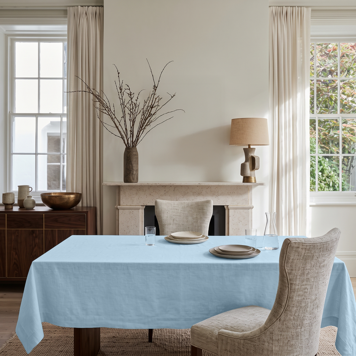 Sky Blue Rectangular Linen Tablecloth in a Transitional Dining Room with Stone Fireplace