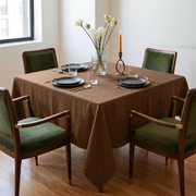 Tawny Brown Square Linen Tablecloth in a Mid-Century Modern Dining Room with Green Velvet Chairs