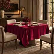 Dark Deep Red Square Velvet Tablecloth in an Elegant Dining Room with Cream Upholstered Chairs