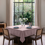 Dusty Pink Square Linen Tablecloth in a Transitional Dining Room with Cane Chairs