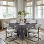 Grey Square Velvet Tablecloth in a Contemporary Dining Room with White Chairs