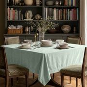 Mint Green Square Velvet Tablecloth in a Transitional Dining Room with Built-In Bookshelves and Patterned Chairs