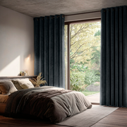 Steel Black Velvet Eyelet Sliding Patio Door Curtains in a Modern Bedroom with Layered Dark Bedding