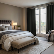 Steel Black Velvet Tab Top Blackout Curtains in a Bedroom with Light Tan Walls