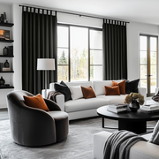 Steel Black Velvet Tab Top Blackout Curtains in a Living Room with Warm White Walls