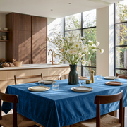 Steel Blue Rectangular Velvet Tablecloth in a Contemporary Kitchen with Walnut Cabinetry and Floor-to-Ceiling Windows