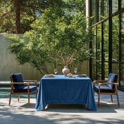 Steel Blue Square Velvet Tablecloth in a Modern Outdoor Dining Area