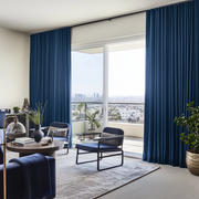 Steel Blue Velvet S-Fold Curtains for Sliding Door in a Contemporary Living Room with City Views, Black Accent Chairs, and Indoor Greenery
@Heading: S-Fold