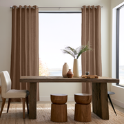Tawny Brown Linen Eyelet Curtains in a Modern Rustic Dining Room with Reclaimed Wood Table and Sculptural Decor