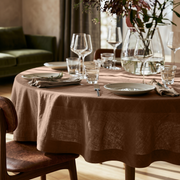 Tawny Brown Linen Round Tablecloth in a Warm Dining Room with Beige Walls