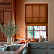 Terracotta Heavy Weight Linen Roman Blinds in a Mediterranean Kitchen with Plaster Walls - Cotton Lining
