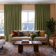 Olive Green Velvet Pencil Pleat Curtains in a Contemporary Living Room with Terracotta Walls and a Cream Sofa