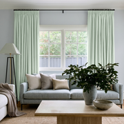 Mint Green Velvet Pencil Pleat Curtains in a Cozy Living Room with Soft Grey Walls and a Light Grey Sofa