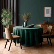 Hunter Green Velvet Round Tablecloth in a Moody Dining Room with Deep Green Walls and Walnut Wood Chairs